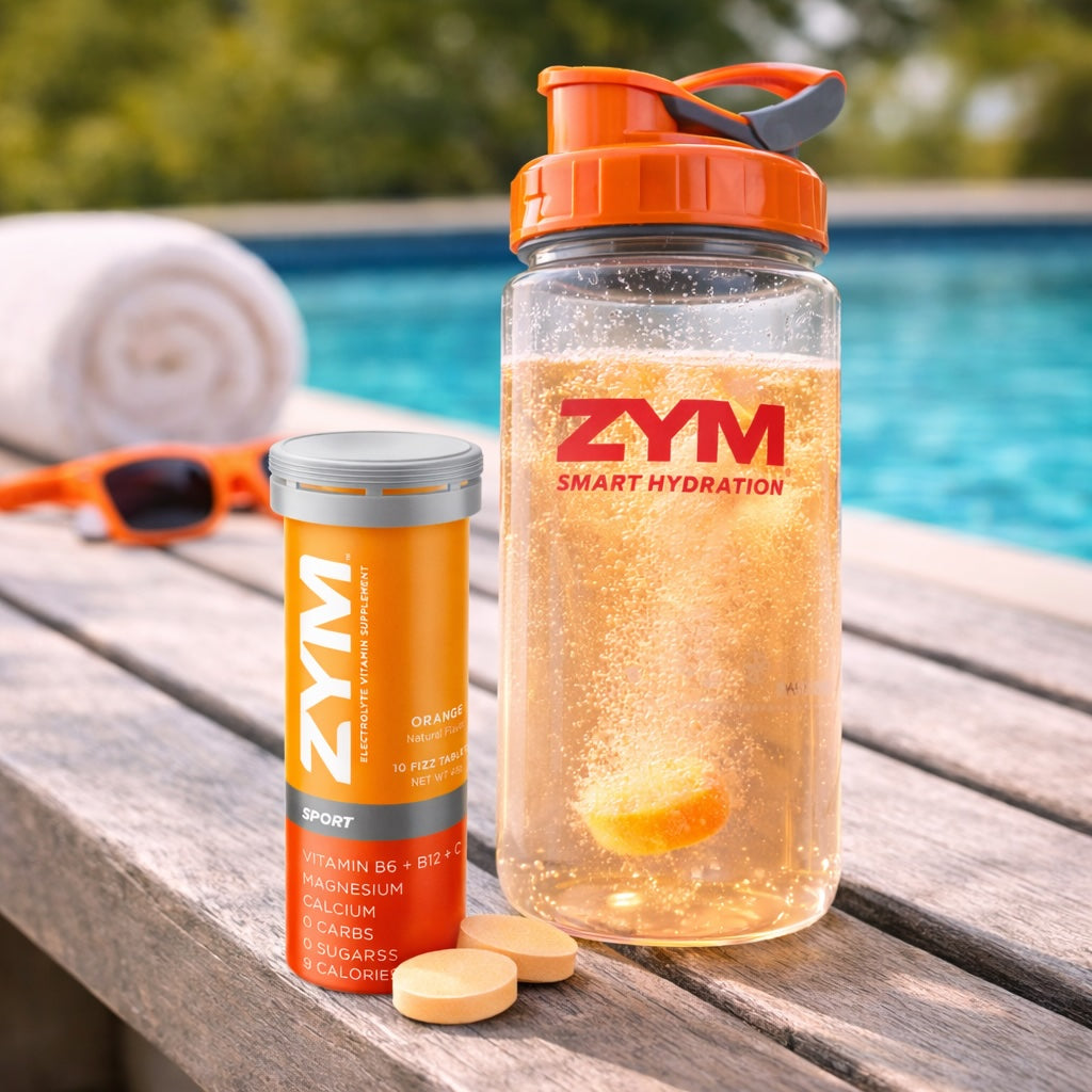 ZYM electrolyte tablets and hydration bottle with effervescent drink by poolside for endurance training